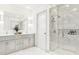 Bright bathroom with double vanity, quartz counters, marble tile shower, and modern fixtures at 208 Byrum St # 5, Cary, NC 27511