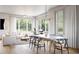 Open-concept living and dining area features hardwood floors, large windows, and a cozy seating arrangement perfect for entertaining at 208 Byrum St # 5, Cary, NC 27511