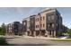 Modern brick townhome with rooftop terrace, black accents, and well-maintained landscaping along the walkway at 210 Byrum St # 6, Cary, NC 27511