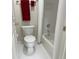 Compact bathroom with a toilet and shower-tub combo with white tile at 210 Shillings Chase Dr, Cary, NC 27518