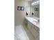 Bright vanity space with white cabinetry, white countertop and a large mirror at 210 Shillings Chase Dr, Cary, NC 27518