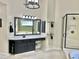 Bright bathroom with stylish vanity featuring a makeup area, and a glass-enclosed shower in view at 210 Shillings Chase Dr, Cary, NC 27518