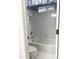 Bathroom featuring a white tiled shower and bathtub combination with a window for natural light at 210 Shillings Chase Dr, Cary, NC 27518