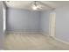 Neutral-toned bedroom featuring carpet, pastel-painted walls, a ceiling fan, and natural light from the window at 210 Shillings Chase Dr, Cary, NC 27518