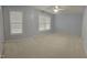 Spacious bedroom with neutral carpet, and a ceiling fan is ready for your personal touches and furnishings at 210 Shillings Chase Dr, Cary, NC 27518