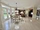 Large dining area with table, French doors, and light wood flooring at 210 Shillings Chase Dr, Cary, NC 27518