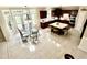 Open dining area with a glass table, wood floors, and natural light from French doors at 210 Shillings Chase Dr, Cary, NC 27518