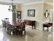 This dining room features a dark wood table, crown molding, and a beautiful chandelier at 210 Shillings Chase Dr, Cary, NC 27518
