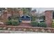 A brick sign for the Windermere community is adorned with greenery and holiday lights at 210 Shillings Chase Dr, Cary, NC 27518