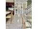 Spacious foyer with hardwood floors and modern lighting leads into an open-concept kitchen and dining area at 210 Shillings Chase Dr, Cary, NC 27518