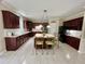 Kitchen boasts a center island, custom cabinets, and white countertops at 210 Shillings Chase Dr, Cary, NC 27518