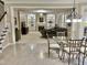 This living room is bright and open, with views into the dining area and staircase at 210 Shillings Chase Dr, Cary, NC 27518