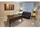 This office features a spacious desk and a comfortable seating area, perfect for working from home at 210 Shillings Chase Dr, Cary, NC 27518