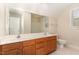 Bathroom with double vanity, large mirror and tile floors at 2205 Karns Pl, Raleigh, NC 27614