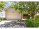 Home with a two car garage, driveway, and well manicured landscaping at 2205 Karns Pl, Raleigh, NC 27614