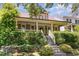 Inviting home with a lovely front porch, stairs and lush landscaping at 2205 Karns Pl, Raleigh, NC 27614