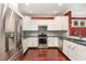 Beautiful kitchen with stainless steel appliances, ample counter space, and stylish white cabinetry at 2205 Karns Pl, Raleigh, NC 27614