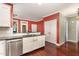 Updated kitchen featuring stainless steel appliances, dark countertops, and hardwood flooring at 2205 Karns Pl, Raleigh, NC 27614