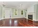 Bright and airy living room with hardwood floors, fireplace, and ample natural light at 2205 Karns Pl, Raleigh, NC 27614