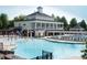 Community pool area with sun loungers and a building with columns at 2205 Karns Pl, Raleigh, NC 27614