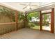 Relaxing screened porch features a ceiling fan and views of the backyard at 2205 Karns Pl, Raleigh, NC 27614