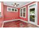 Bright sunroom with hardwood floors, large windows, and a glass door to the exterior at 2205 Karns Pl, Raleigh, NC 27614