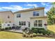 Spacious backyard with green lawn and a patio set, perfect for outdoor living at 2305 Everstone Rd, Wake Forest, NC 27587