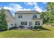 Spacious backyard with green lawn and a patio set, perfect for outdoor living at 2305 Everstone Rd, Wake Forest, NC 27587