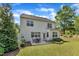 Spacious backyard with green lawn and a patio set, perfect for outdoor living at 2305 Everstone Rd, Wake Forest, NC 27587