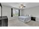 Bright bedroom featuring neutral walls, carpet flooring and a ceiling fan at 2305 Everstone Rd, Wake Forest, NC 27587