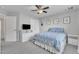 A comfortable bedroom with double closet doors, a ceiling fan and neutral decor at 2305 Everstone Rd, Wake Forest, NC 27587