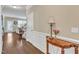 Inviting entryway featuring hardwood floors, elegant trim, and a view into the living area at 2305 Everstone Rd, Wake Forest, NC 27587