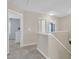 Hallway with carpet, neutral paint, and doorways to various rooms at 2305 Everstone Rd, Wake Forest, NC 27587