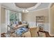 Well-lit home office featuring a large window, shelving, and elegant furnishings at 2305 Everstone Rd, Wake Forest, NC 27587