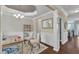 Stylish home office with rich hardwood floors, tray ceiling, and elegant decor at 2305 Everstone Rd, Wake Forest, NC 27587