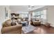 Spacious living room with hardwood floors, open floor plan, and modern decor at 2305 Everstone Rd, Wake Forest, NC 27587