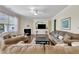 Comfortable living room with a fireplace, built-in shelving, and a large TV at 2305 Everstone Rd, Wake Forest, NC 27587