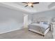 Spacious main bedroom features a tray ceiling, ceiling fan and neutral color palette at 2305 Everstone Rd, Wake Forest, NC 27587