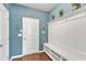 Stylish mudroom with built-in bench seating, storage shelves, and coat hooks for organization and convenience at 2305 Everstone Rd, Wake Forest, NC 27587