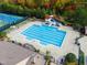 Aerial view of the community pool featuring a slide and ample deck space with lounge chairs at 2305 Everstone Rd, Wake Forest, NC 27587