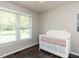 Bright bedroom features a large window with natural light and a white crib at 235 Stephenson Rd, Benson, NC 27504