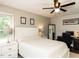 Comfortable bedroom with a neutral palette, ceiling fan, and natural light at 235 Stephenson Rd, Benson, NC 27504