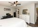 Spacious bedroom featuring a ceiling fan, and ample storage with dresser and mirror at 235 Stephenson Rd, Benson, NC 27504