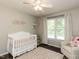Charming Bedroom with crib, accent rug, and natural light at 235 Stephenson Rd, Benson, NC 27504