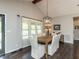 Dining room features a large window and dark wood floors at 235 Stephenson Rd, Benson, NC 27504