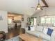 Spacious living room with vaulted ceilings and views into the kitchen at 235 Stephenson Rd, Benson, NC 27504