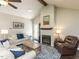 Cozy living room featuring a fireplace, dark wood floors, and neutral walls at 235 Stephenson Rd, Benson, NC 27504
