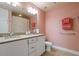 Bright bathroom with double sink vanity, granite countertops, and tiled floors at 2410 Environ Way, Chapel Hill, NC 27517