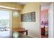 Open dining area with modern lighting, vibrant artwork, and access to balcony at 2410 Environ Way, Chapel Hill, NC 27517