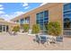Condo building with a patio, and tables and chairs at 2410 Environ Way, Chapel Hill, NC 27517